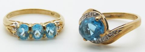 Two 9ct gold rings set with blue topaz and diamonds, 4.5g