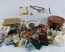 A large collection of costume jewellery including beads, brooches, watches, scarab beetle