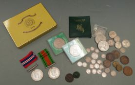 Small collection of coins including Victorian silver examples, a pair of WWII medals, and three
