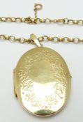 A 9ct gold locket and chain, 21.2g