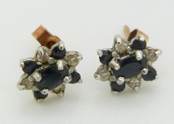 A pair of 9ct gold earrings set with sapphires and diamonds