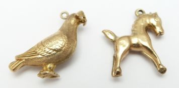 A 9ct gold charm/ pendant in the form of a dove, 2 x 2cm and a 9ct gold pendant/charm in the form of