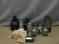 Nine Hurricane and similar lamps together with a stand and various parts