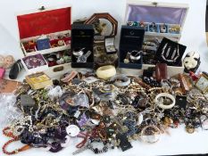 A collection of costume jewellery including beads, brooches etc