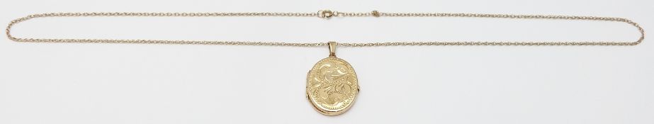 A 9ct gold locket and chain, 2.7g