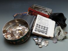 A collection of UK and overseas coins, some silver, together with 2002 World Coins book and a