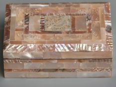 A mother of pearl box with pierced and carved decoration, approximately 13 x 9 x 4cm