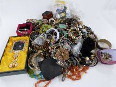 A large collection of costume jewellery including bangles, beads etc