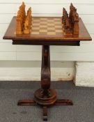 Wooden chess table and chess set, the pieces carved as oceanic creatures and mermaids, the table