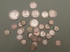 A collection of silver UK coinage including George III sixpence with semee of hearts 1787, Victorian