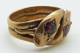 A 9ct gold snake ring set with two garnets, size P, 6g.