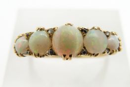 An 18ct gold ring set with opal cabochons and diamonds, 3.5g, size O