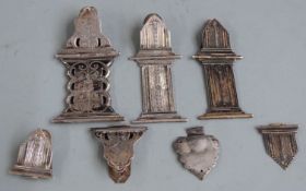 Collection of white metal book clasp or similar fittings, one having Dutch silver marks, weight 52g