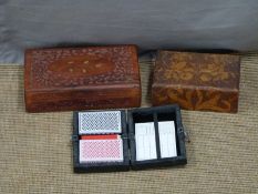 Two carved wooden boxes, one with brass inlay and a bridge/playing card set
