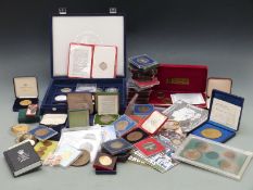 A large collection of cased commemorative coins and medal coins together with a quantity of
