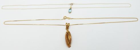 A 9ct gold necklace set with topaz and a 9ct gold necklace, 5.2g