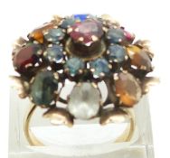 A 14k gold ring set with a pink sapphire, blue/ green sapphires, tiger's eye, ruby, garnet,