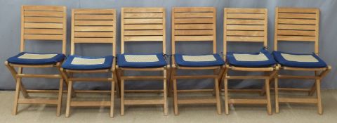 Six folding garden chairs with cushions