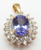 A 9ct gold pendant set with an oval cut tanzanite surrounded by diamonds