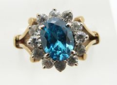 A 9ct gold ring set with blue topaz and cubic zirconia, 3.4g, size K