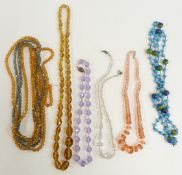 Four Art Deco crystal necklaces and a glass necklace