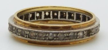 An 18ct gold eternity ring set with paste, size O, 4.1g.