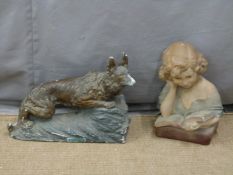 Two French Art Deco figures, one of a girl reading a book, the other of a German shepherd dog,