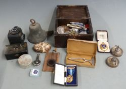 19thC bronze bell, mineral samples including raw amber, spirit flask, badges, stopwatch, Negretti