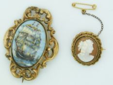 Victorian brooch set with a Limoges plaque depicting a ship together with a cameo brooch