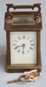 Brass cased carriage clock with Roman dial, 11cm tall