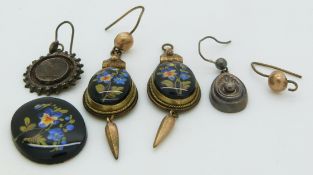 A pair of Victorian earrings set with floral plaques and two unmatched silver Victorian earrings
