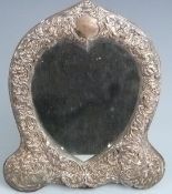 Victorian hallmarked silver heart shaped dressing table mirror with embossed frame decorated with