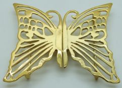 A silver gilt buckle in the form of a butterfly