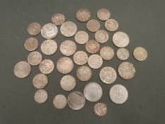 A collection of Austrian silver coinage, largely uncirculated, includes Winter Olympic Commemorative