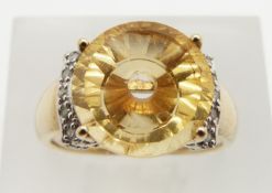 A 9ct gold ring set with citrine and diamonds, 5.7g, size J