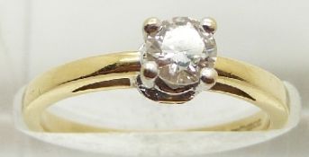 An 18ct gold ring set with a round brilliant cut diamond measuring approximately 0.3ct with
