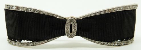 Belle Epoque bow brooch set with diamonds and black ribbon, 5.4cm long