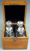 Asprey London oak bottle case set with four 19C or early 20thC cut glass decanters or apothecary