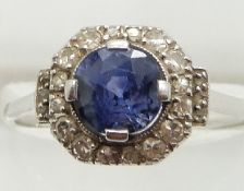 Art Deco platinum ring set with a round cut sapphire measuring approximately 1.8ct surrounded by