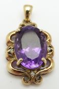 A 9ct gold pendant set with an oval cut amethyst and diamonds, 4.4g