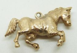 A 9ct gold horse pendant/ charm, 5g