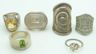 A silver ring set with oval citrine, a silver ring set with paste, silver ring with textured