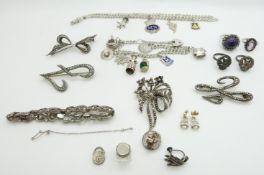 A collection of silver and marcasite jewellery including bracelet, brooches, rings, and two silver