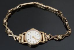 Avia 9ct gold ladies wristwatch with gold hands, two-tone baton markers, silver dial and quartz