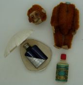 A monkey perfume container together with bottles of Eau de Cologne No 4711 and Evening in Paris