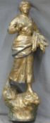 Gilt metal figure of a lady carrying corn, height 57cm