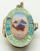 Egyptian Revival charm set with enamel, opening to reveal a baby