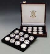 Royal Mint deluxe wooden case containing twenty four Queen Mother silver crown sized coins in