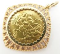 A 1911 gold half sovereign in 9ct gold mount, 6.5g