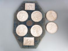 A display of six Bing Grondahl Eneret parian type plaques with central bronzed medallion, overall